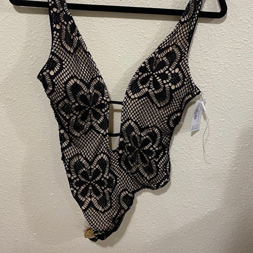 Never worn bathing suit/body suit